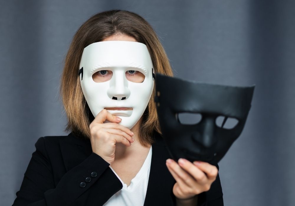 person with two different masks
