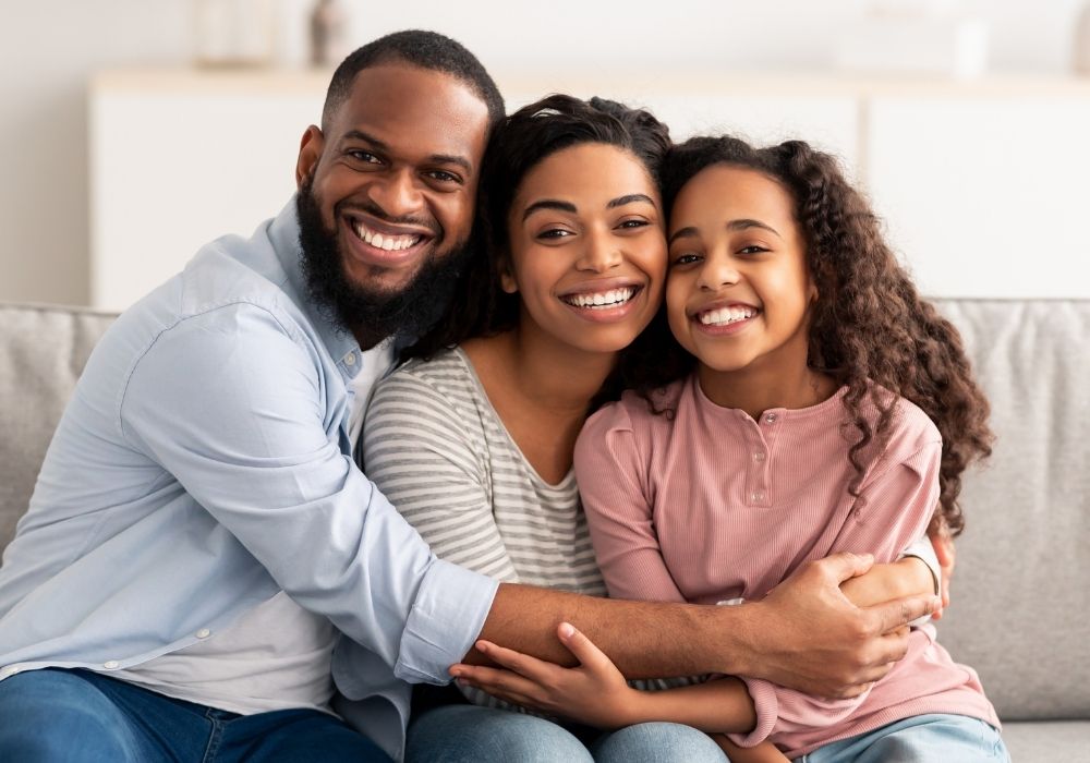family smiling in a photo